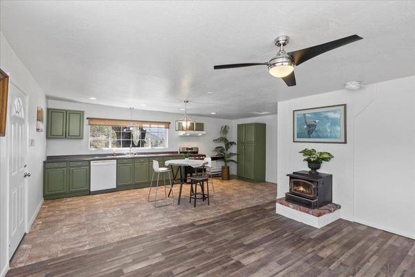 Dining room, Fireplace, Interior, Kitchen, Pendant Lights, Recessed Lighting, Wood Texture Flooring