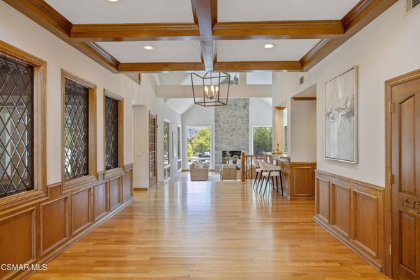 Chandelier, Dining room, Fireplace, Interior, Living room, Pendant Lights, Recessed Lighting, Wooden Beams, Wood Texture Flooring
