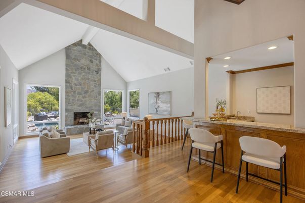 Fireplace, Interior, Living room, Recessed Lighting, Stone Walls, Wood Texture Flooring