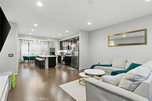Dining room, Interior, Kitchen, Living room, Recessed Lighting, Stainless Steel Appliances, Wood Texture Flooring
