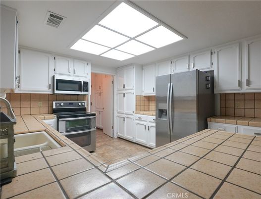 Interior, Kitchen, Stainless Steel Appliances, Tile Countertops