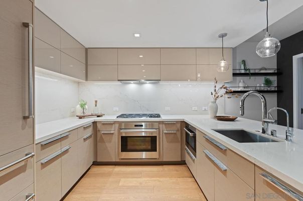 Interior, Kitchen, Marble Walls, Pendant Lights, Recessed Lighting, Stainless Steel Appliances, Wood Texture Flooring