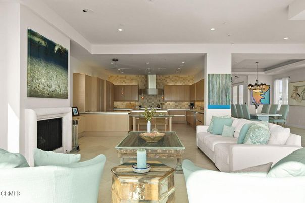 Chandelier, Dining room, Fireplace, Interior, Kitchen, Living room, Pendant Lights, Recessed Lighting, Stainless Steel Appliances
