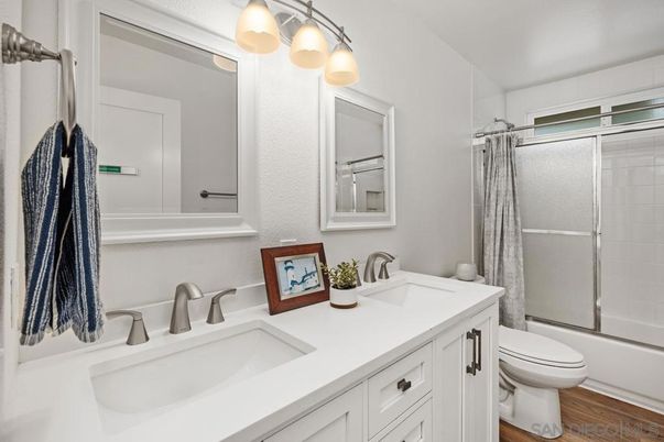 Bathroom, Dual Sink Vanities, Glass Shower, Interior, Wood Texture Flooring