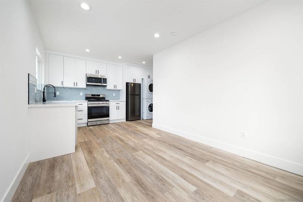 Interior, Kitchen, Recessed Lighting, Stainless Steel Appliances, Washer, Wood Texture Flooring