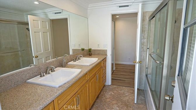 Bathroom, Dual Sink Vanities, Glass Shower, Interior, Recessed Lighting, Wood Texture Flooring