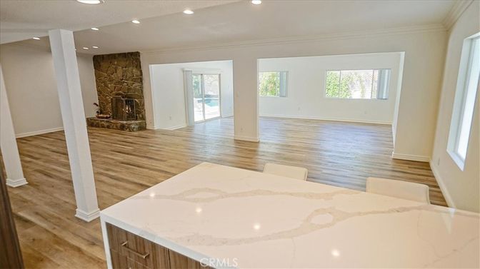 Fireplace, Interior, Recessed Lighting, Stone Walls, Wood Texture Flooring