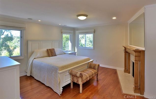 Bedroom, Fireplace, Interior, Recessed Lighting, Wood Texture Flooring