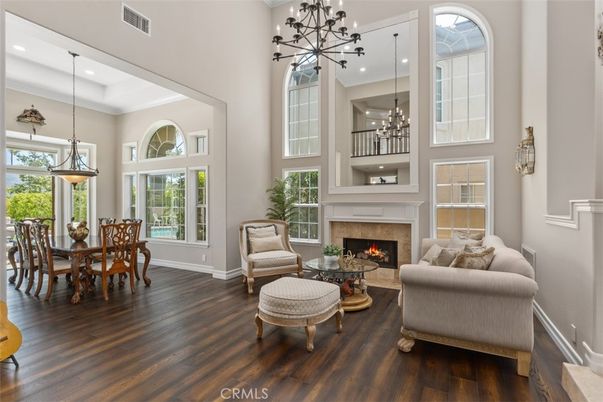 Dining room, Fireplace, Interior, Living room, Pendant Lights, Recessed Lighting, Wood Texture Flooring