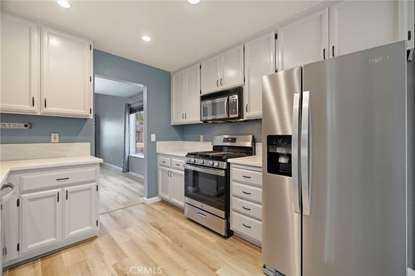 Chandelier, Interior, Kitchen, Pendant Lights, Recessed Lighting, Stainless Steel Appliances, Wood Texture Flooring