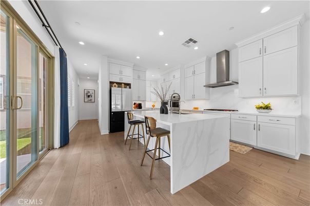 Interior, Kitchen, Marble Walls, Recessed Lighting, Stainless Steel Appliances, Wood Texture Flooring