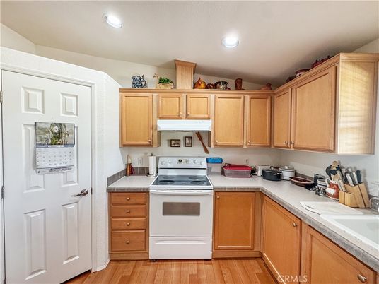 Interior, Kitchen, Recessed Lighting, Tile Countertops, Wood Texture Flooring
