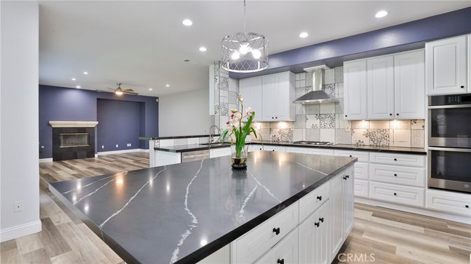 Fireplace, Interior, Kitchen, Pendant Lights, Recessed Lighting, Stainless Steel Appliances, Wood Texture Flooring