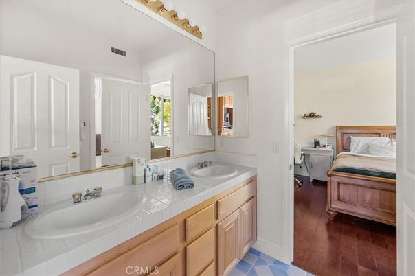 Bathroom, Bedroom, Dual Sink Vanities, Interior, Tile Countertops, Wood Texture Flooring