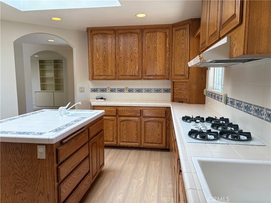 Interior, Kitchen, Recessed Lighting, Tile Countertops, Wood Texture Flooring