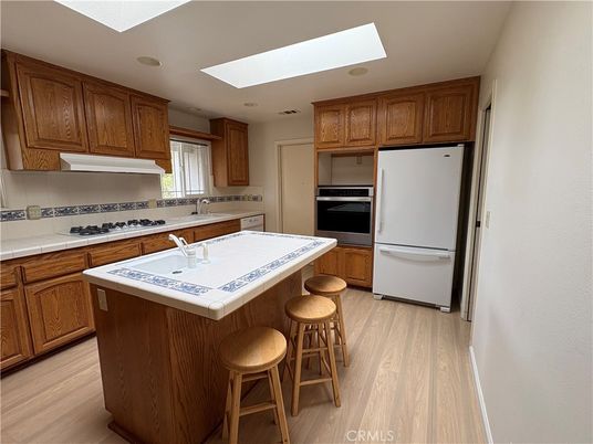 Interior, Kitchen, Recessed Lighting, Tile Countertops, Wood Texture Flooring