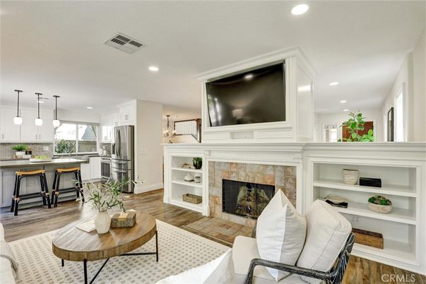 Fireplace, Interior, Kitchen, Living room, Pendant Lights, Recessed Lighting, Stainless Steel Appliances, Wood Texture Flooring