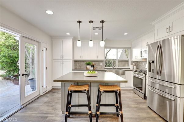 Interior, Kitchen, Pendant Lights, Recessed Lighting, Stainless Steel Appliances, Wood Texture Flooring