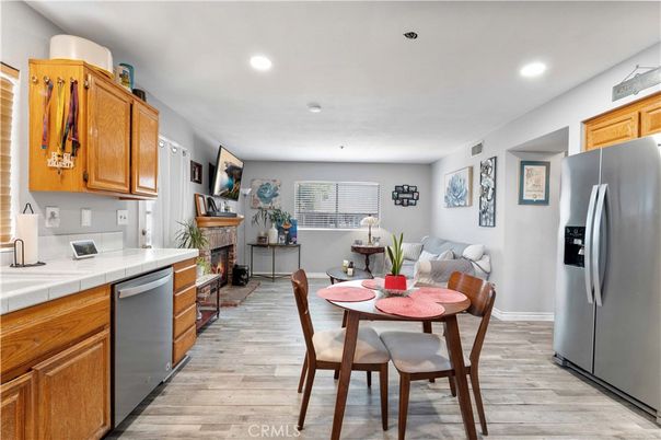 Dining room, Fireplace, Interior, Kitchen, Recessed Lighting, Tile Countertops, Wood Texture Flooring