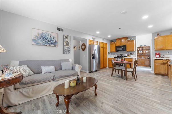 Dining room, Interior, Kitchen, Living room, Recessed Lighting, Stainless Steel Appliances, Wood Texture Flooring