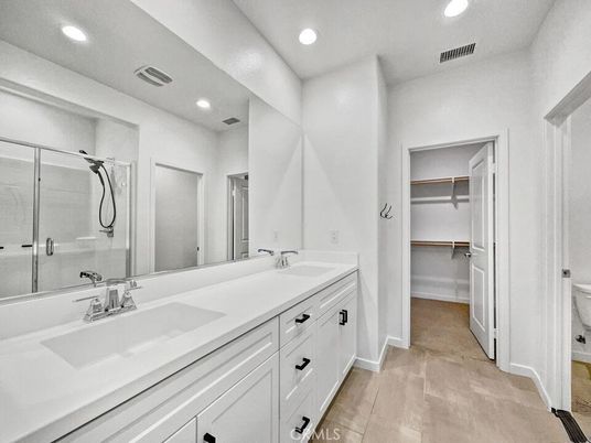 Bathroom, Dual Sink Vanities, Glass Shower, Interior, Recessed Lighting, Walk-in Closets