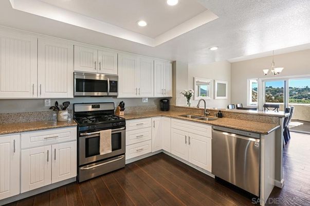 Chandelier, Interior, Kitchen, Pendant Lights, Recessed Lighting, Stainless Steel Appliances, Wood Texture Flooring