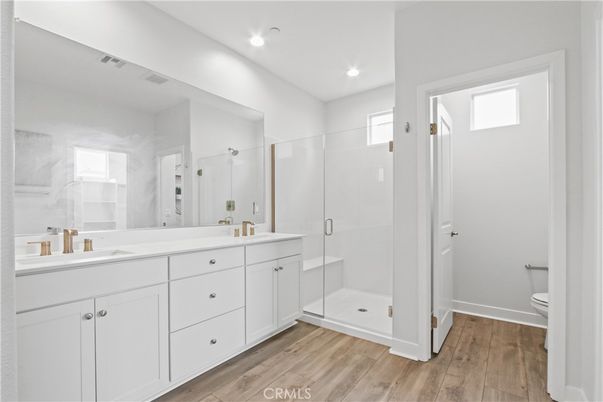 Bathroom, Dual Sink Vanities, Glass Shower, Interior, Recessed Lighting, Wood Texture Flooring