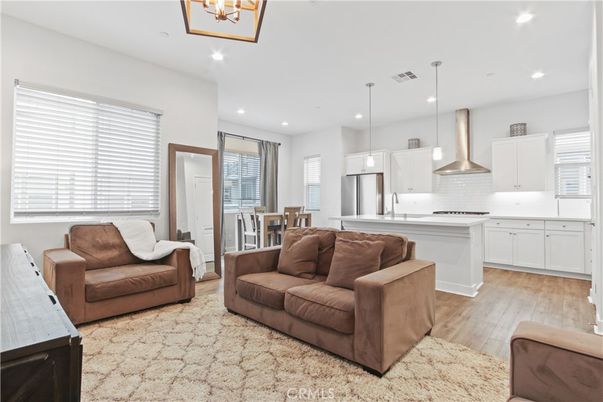 Dining room, Interior, Kitchen, Living room, Pendant Lights, Recessed Lighting, Stainless Steel Appliances, Wood Texture Flooring
