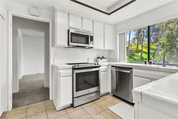 Interior, Kitchen, Stainless Steel Appliances, Tile Countertops