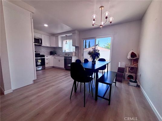 Dining room, Interior, Kitchen, Pendant Lights, Recessed Lighting, Stainless Steel Appliances, Wood Texture Flooring