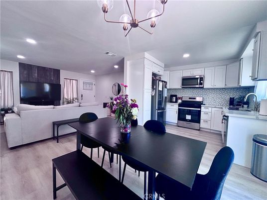 Dining room, Interior, Kitchen, Living room, Recessed Lighting, Stainless Steel Appliances, Wood Texture Flooring