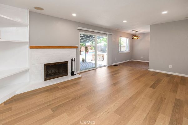 Empty room, Fireplace, Interior, Pendant Lights, Recessed Lighting, Wood Texture Flooring