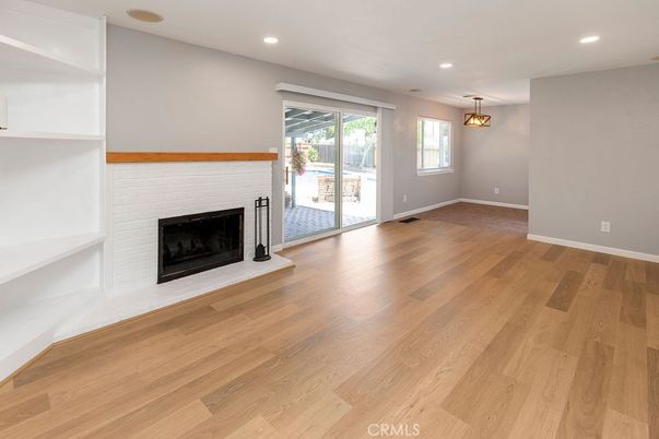 Empty room, Fireplace, Interior, Pendant Lights, Recessed Lighting, Wood Texture Flooring