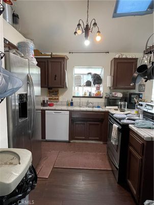 Interior, Kitchen, Stainless Steel Appliances, Tile Countertops, Wood Texture Flooring