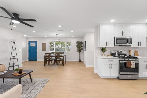 Chandelier, Dining room, Interior, Kitchen, Pendant Lights, Recessed Lighting, Stainless Steel Appliances, Wood Texture Flooring