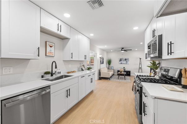 Dining room, Interior, Kitchen, Living room, Recessed Lighting, Stainless Steel Appliances, Wood Texture Flooring