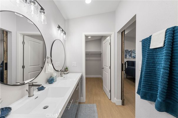Bathroom, Dual Sink Vanities, Interior, Recessed Lighting, Wood Texture Flooring