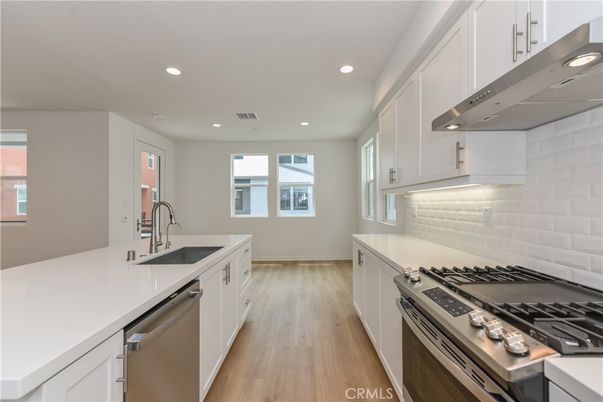 Interior, Kitchen, Recessed Lighting, Stainless Steel Appliances, Wood Texture Flooring