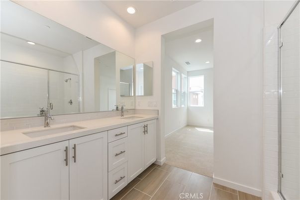 Bathroom, Dual Sink Vanities, Glass Shower, Interior, Recessed Lighting, Wood Texture Flooring