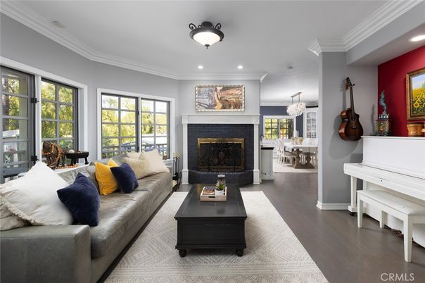 Chandelier, Dining room, Fireplace, Interior, Living room, Piano, Recessed Lighting, Wood Texture Flooring