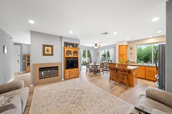 Dining room, Fireplace, Interior, Kitchen, Recessed Lighting, Wood Texture Flooring