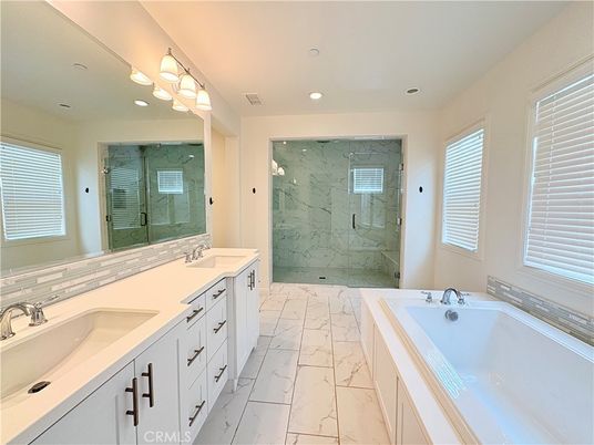 Bathroom, Dual Sink Vanities, Glass Shower, Interior, Marble, Marble Walls, Recessed Lighting