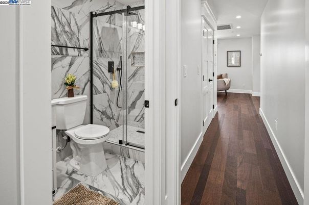 Bathroom, Glass Shower, Interior, Marble, Marble Walls, Recessed Lighting, Wood Texture Flooring