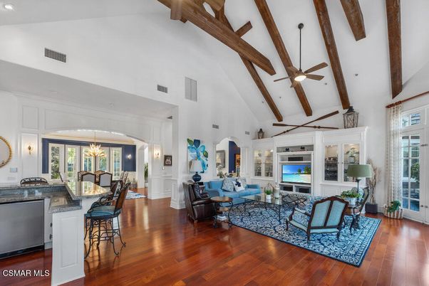 Chandelier, Dining room, Fireplace, Interior, Living room, Pendant Lights, Recessed Lighting, Wooden Beams, Wood Texture Flooring