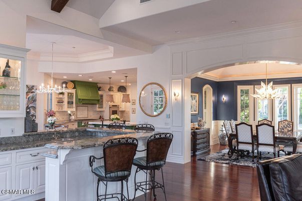 Chandelier, Dining room, Interior, Kitchen, Pendant Lights, Recessed Lighting, Stainless Steel Appliances, Wood Texture Flooring
