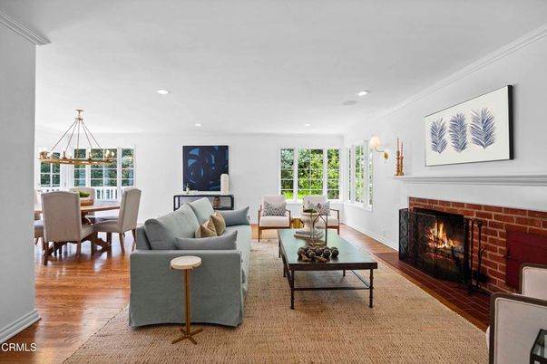 Dining room, Fireplace, Interior, Living room, Recessed Lighting, Stone Walls, Wood Texture Flooring