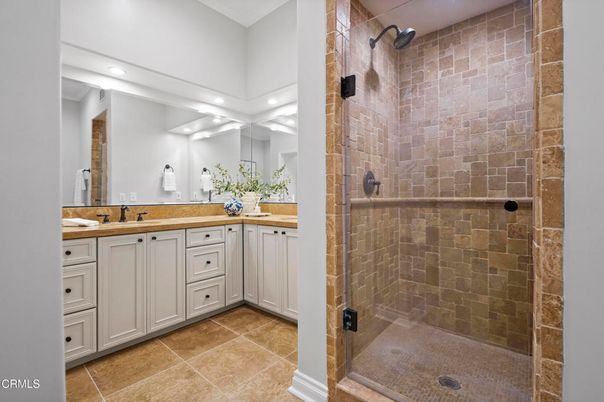 Bathroom, Dual Sink Vanities, Glass Shower, Interior, Recessed Lighting, Stone Walls