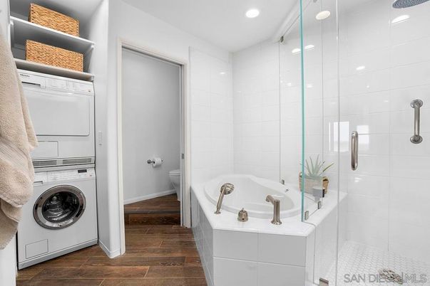 Bathroom, Glass Shower, Interior, Recessed Lighting, Utility Closets, Washer, Wood Texture Flooring