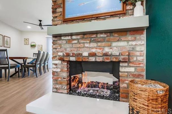 Dining room, Fireplace, Interior, Recessed Lighting, Stone Walls, Wood Texture Flooring