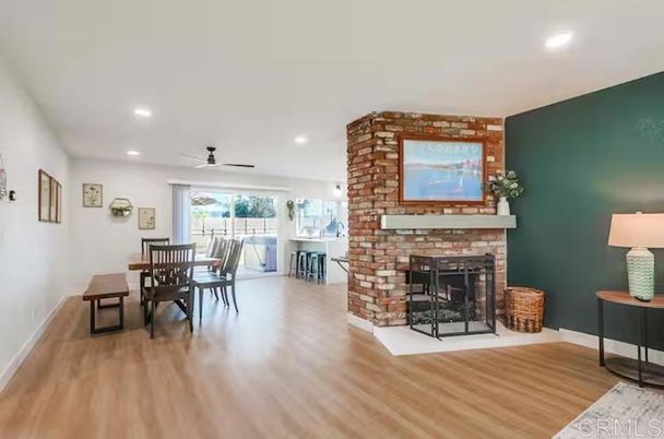 Dining room, Fireplace, Interior, Recessed Lighting, Stone Walls, Wood Texture Flooring